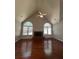 Spacious living room with vaulted ceiling, fireplace, and hardwood floors at 3650 Burnt Hickory Dr, Dacula, GA 30019