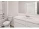 Clean bathroom with a tub-shower combo, toilet, and vanity with ample counter space and a mirror at 644 Kimberwick Dr, Locust Grove, GA 30248