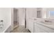 Spacious bathroom featuring a double vanity with marble countertop and neutral-toned tile flooring at 644 Kimberwick Dr, Locust Grove, GA 30248