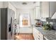 Modern kitchen with stainless steel appliances, granite countertops, and ample natural light at 224 Carroll Se St, Atlanta, GA 30312