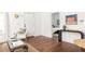 Open living area with hardwood floors leading into a bedroom, decorated with a console table at 224 Carroll Se St, Atlanta, GA 30312