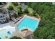 Aerial view of community pool with lounge chairs and recreational area surrounded by lush green trees at 226 Patti Pl, Canton, GA 30114