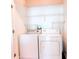 Laundry room with a white washer and dryer set at 250 Pharr Ne Rd # 1507, Atlanta, GA 30305