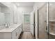 Bathroom featuring double sink vanity and glass enclosed shower at 3954 Brushy St, Powder Springs, GA 30127