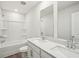 A bathroom features a double sink vanity, a shower and tub combination, and a toilet at 3954 Brushy St, Powder Springs, GA 30127