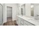 Bathroom featuring double sink vanity and a walk-in closet at 3954 Brushy St, Powder Springs, GA 30127