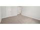A bedroom features neutral carpet, white walls, a window and closet at 3954 Brushy St, Powder Springs, GA 30127