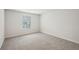 Empty bedroom featuring neutral carpet, white walls, and a window at 3954 Brushy St, Powder Springs, GA 30127