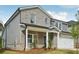Charming two-story home with a gray brick facade, well-manicured lawn, and attached two-car garage at 3954 Brushy St, Powder Springs, GA 30127