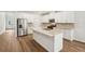 Well-equipped kitchen with stainless steel appliances, granite countertops, and a large island at 3954 Brushy St, Powder Springs, GA 30127