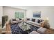 Staged living room boasts modern furniture, a stylish rug, and an airy atmosphere at 3954 Brushy St, Powder Springs, GA 30127