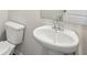 Powder room featuring a pedestal sink and toilet at 3954 Brushy St, Powder Springs, GA 30127
