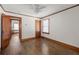 Empty bedroom with hardwood floors, white walls, wood trim and windows at 1046 Faith Se Ave, Atlanta, GA 30316