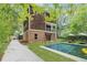 Backyard view featuring a refreshing swimming pool, patio area and lots of space for outdoor activities at 1303 N Druid Hills Ne Rd, Brookhaven, GA 30319