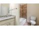 Bathroom featuring vanity, mirror, bathtub with tile backsplash, and toilet at 1303 N Druid Hills Ne Rd, Brookhaven, GA 30319