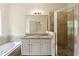 This bathroom features a double vanity, separate shower and tub at 1303 N Druid Hills Ne Rd, Brookhaven, GA 30319