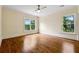 Large bedroom with hardwood floors and bright windows with views at 1303 N Druid Hills Ne Rd, Brookhaven, GA 30319