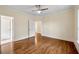 Bright bedroom with hardwood floors, ceiling fan and neutral paint at 1303 N Druid Hills Ne Rd, Brookhaven, GA 30319