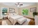 Bright bedroom with hardwood floors, natural light, and a cozy atmosphere, perfect for relaxation and rest at 1303 N Druid Hills Ne Rd, Brookhaven, GA 30319