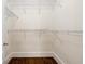 This walk-in closet boasts wire shelving and wood floors at 1303 N Druid Hills Ne Rd, Brookhaven, GA 30319