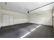 Spacious two-car garage features white walls and trim, and a clean epoxy floor at 1303 N Druid Hills Ne Rd, Brookhaven, GA 30319