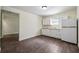 This kitchen is equipped with white cabinets and laminate floors at 1303 N Druid Hills Ne Rd, Brookhaven, GA 30319