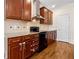 Kitchen features stainless steel appliances, granite countertops, and wooden cabinets at 1303 N Druid Hills Ne Rd, Brookhaven, GA 30319