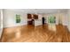 Open concept living room features a large kitchen and hardwood floors at 1303 N Druid Hills Ne Rd, Brookhaven, GA 30319