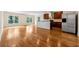 Open concept living room features a large kitchen and hardwood floors at 1303 N Druid Hills Ne Rd, Brookhaven, GA 30319