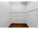 Walk-in closet with hardwood floors and wire shelving for optimal storage and organization at 1303 N Druid Hills Ne Rd, Brookhaven, GA 30319