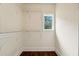 Walk-in closet features custom shelving and a window for natural light at 1303 N Druid Hills Ne Rd, Brookhaven, GA 30319
