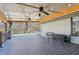 Large back patio with a ceiling fan, outdoor seating, and views of the surrounding yard at 1310 Dillon Rd, Austell, GA 30168