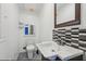 Cozy bathroom with tiled accent wall, and modern vanity at 1310 Dillon Rd, Austell, GA 30168