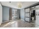 Bedroom with wood-look flooring and a modern glass sliding barn door to the bathroom at 1310 Dillon Rd, Austell, GA 30168