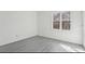 Bright bedroom with neutral walls, wood flooring, and large windows at 1310 Dillon Rd, Austell, GA 30168