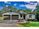 Charming home featuring an attached two car garage, landscaped front yard and stucco finish at 1310 Dillon Rd, Austell, GA 30168