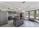 Modern kitchen with stainless steel appliances, dark countertops, and an island cooktop with range hood at 1310 Dillon Rd, Austell, GA 30168