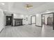 Spacious living room featuring wood-look floors and a stylish, updated fireplace with black accents at 1310 Dillon Rd, Austell, GA 30168