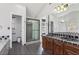 Bathroom featuring a glass enclosed shower, dual sinks, and plenty of natural light at 1310 Dillon Rd, Austell, GA 30168