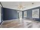 Bedroom featuring modern paint, stylish ceiling fan, and access to the ensuite bathroom at 1310 Dillon Rd, Austell, GA 30168