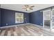 Spacious bedroom with stylish dark walls and a sliding barn door to the bathroom at 1310 Dillon Rd, Austell, GA 30168