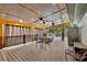 Inviting covered patio featuring a wood ceiling, dual fans, and a cozy seating area at 1310 Dillon Rd, Austell, GA 30168