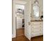 Bedroom with a walk-in closet, hardwood flooring and a large mirror above the dresser at 404 Oakdale Ne Rd, Atlanta, GA 30307