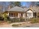 Charming yellow home with a welcoming front porch and neat landscaping at 404 Oakdale Ne Rd, Atlanta, GA 30307