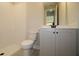 Well-lit bathroom with a walk-in shower, modern vanity, and neutral color scheme at 206 Wild Ginger Bend, Woodstock, GA 30188