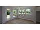 Elegant dining room with ample natural light and a view of the backyard at 206 Wild Ginger Bend, Woodstock, GA 30188