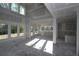 Unfinished living room featuring drywall, concrete floors, many windows and natural light at 206 Wild Ginger Bend, Woodstock, GA 30188