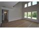 Spacious living room with high ceilings and multiple windows providing natural light at 206 Wild Ginger Bend, Woodstock, GA 30188