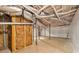 Unfinished basement with exposed insulation, ductwork, and support beams, offering potential for customization at 2419 Edgewater Sw Dr, Atlanta, GA 30311