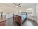 Bedroom with hardwood floors, ceiling fan, double closets, and a white accent table at 2419 Edgewater Sw Dr, Atlanta, GA 30311